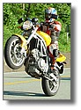 Hyosung GT650 yellow wheelie.jpg